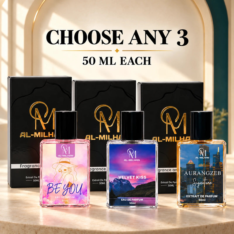Choose any 3: Be You, Velvet Kiss and Aurangzeb with three black Al Milhan cartons on a softly lit champagne and teal architectural platform. Pictured bottles are eligible examples.